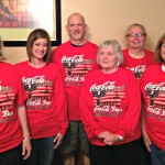 Members of the Coca Cola Committee wearing the new shirts.