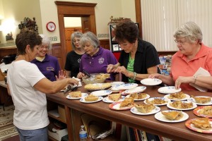 Atlantic Business and Professional Women volunteer at Harvest Fest last year, serving the apple pie from the judged contest. Sponsored by Gade Insurance and Downtowner Café & Catering, the contest is open for commercial and private entries, and pies are to be delivered to the Depot by 2 p.m. for judging. The warm apple pie and smoked pork and brisket are served prior to the Firemen’s Parade at the Depot Saturday.