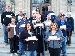 Cass County agency representatives received their checks on November 15th