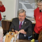 Gov. Branstad putting the label on the millionth bottle at the Templeton Rye distillery in Templeton, Iowa, Wednesday morning.