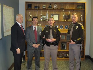Commissioner Noble, 3M Corporation Government Services Manager Tom Pugh, Trooper Brosam (Center) and Colonel Garrison are shown in the photo provided by the ISP.