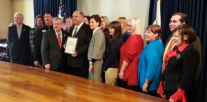 Guthrie Center officials join Gov. Branstad for the Main Street IA announcement. 