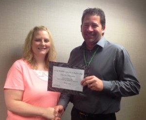 Todd Hudspeth, CEO, presented the award to Heather Foresman. 