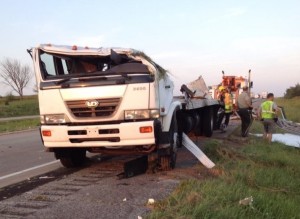 Wrecker crews wrangle with the rolled over straight truck Friday evening. (phot by Mike Kennnon/Cass Co. Emergency Management)
