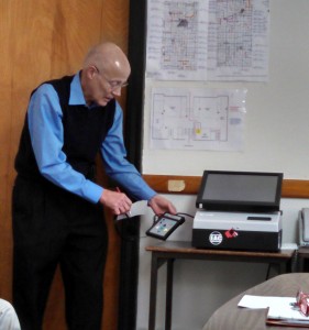 Cass Co. Auditor Dale Sunderman demonstrates a new voting machine for the blind/visually impaired. 