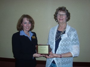 Jolene Smith, a member of Royal Neighbors of America Chapter 1373, Atlantic, IA, at right, was presented a plaque from Sarah Reemtsma on behalf of the Iowa Fraternal Alliance. In recognition of her volunteer efforts in the community, Jolene was honored as a 2014 Iowa fraternalist of the Year. (Photo provided)