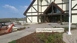 The Museum of Danish America is currently in the process of re-landscaping its front entry in order to integrate a pathway to the green roof that sits atop the new Curatorial Center which will celebrate its Grand Opening on October 18. Outdoor informational signage will also be put into place throughout the Jens Jensen Prairie Landscape Park by the time of the Grand Opening.