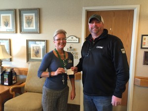 Ann Smith with ANRC and Darrin Petty of the Trevor Frederickson Memorial Fund. (Photo submitted by Melanie Petty)