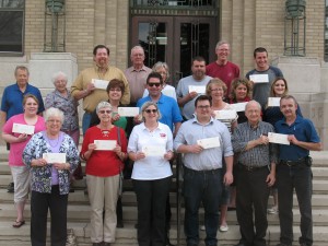 Representatives of various Cass County Organizations proudly display their CCCF grant checks Friday afternoon. 