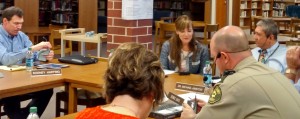 Atlantic School Board members don new headsets designed to make it easier for persons attending the meetings to hear Board conversations better. 