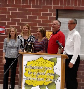 DeLana Harris (Center) receives her Outstanding Teacher of the Year Award