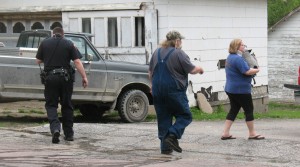 Misty Amdor holds one of the dogs rescued from the fire.