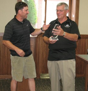 Ron Flory (Left) jokes around as his accepts an award from Atlantic Mayor Dave Jones. 