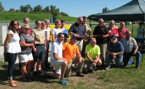 Parks & Rec Board President Stuart Dusenberry cuts the ribbon for the Buck Creek Dog Park