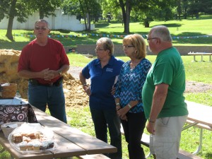 Roger Herring talks about Dean Orstad with his extended family members looking on. 