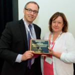 Crystal Starlin, Pharm D, CCMH Pharmacy Director, accepts an award for the340B Drug Pricing Program from Ted Slafsky, 340B President and CEO.