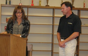 Rodney Hartwig receives recognition from departing Board President Kristy Pellett.