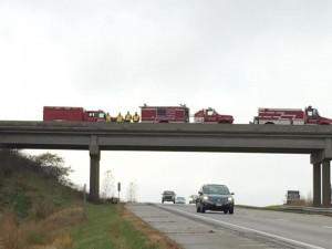 Firefighters from Minden stand ready to honor the WTC beam convoy as they prepare to pass by. (Minden Fire & Rescue Facebook page photo)
