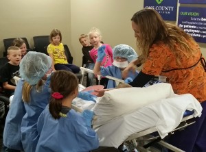 First-graders from CAM North participated in a play that walks the students through a mock tonsillectomy. (Photo courtesy CCMH)