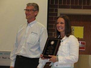 Jodie Hogue receives her "Teacher of the Year" Award from Atlantic Rotary President Ted Robinson