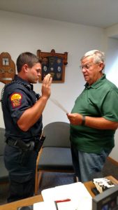 Atlantic Mayor Dave Jones administers the Oath of Honor and Conduct to Christian Holzapfel. (Photo from the A-PD's Facebook page) 